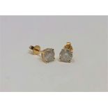 A pair of 14ct gold diamond stud earrings, the brilliant-cut stones having a total weight of 1.