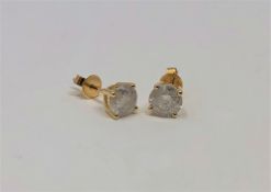 A pair of 14ct gold diamond stud earrings, the brilliant-cut stones having a total weight of 1.