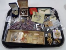 A quantity of costume jewellery, brooches,