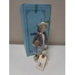 A Lladro figure - Girl with doll, boxed.