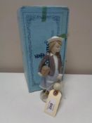 A Lladro figure - Girl with doll, boxed.