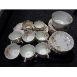 A tray of antique tea china,