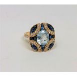 A 14ct gold aquamarine, sapphire and diamond ring, the aquamarine weighing 2.