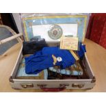 A vintage suitcase containing Masonic apron,