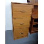 A modern three drawer filing chest together with a four drawer chest