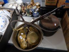 A brass jam pan together with miniature brass warming pans,