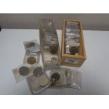Two small boxes of coins in plastic slips,