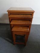 A nest of Eastern hardwood glass topped tables CONDITION REPORT: Tallest 64.5cm high.