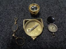 A pair of antique spectacles together with a brass compass,