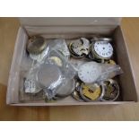 A box of pocket watch parts and cases