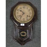 An early twentieth century Seikosha Japanese wall clock with pendulum