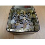 A tin of world coins