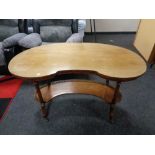 A nineteenth century mahogany kidney shaped table with gallery under stretcher CONDITION