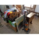 A pallet of bric a brac, boxes of kitchen items, sundries, Dyson vac, drop sided table,