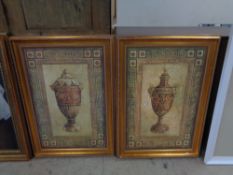 A pair of gilt framed pictures depicting urns