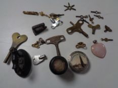 A small quantity of collectables including pocket watch, keys,