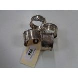 Four antique silver napkin rings, 84.3g.