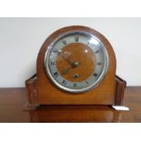 A 1920's oak mantel clock