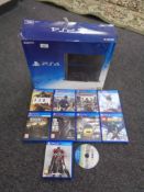 A Sony PS4 with 500GB, nine assorted games including Watch Dogs,