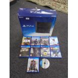 A Sony PS4 with 500GB, nine assorted games including Watch Dogs,