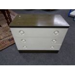 A bank of mid century stag chest of drawers together with three drawer chest