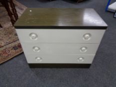 A bank of mid century stag chest of drawers together with three drawer chest