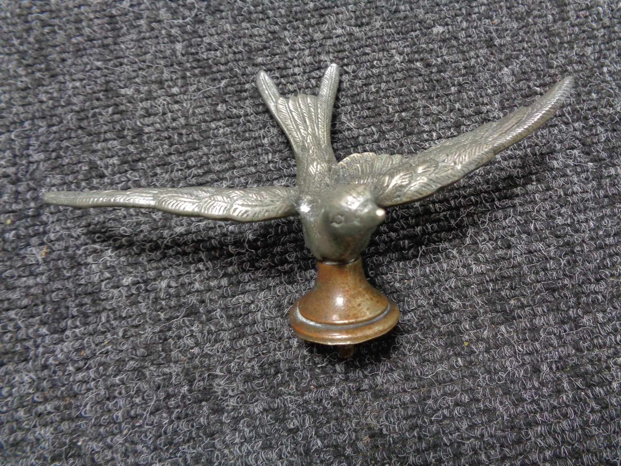 A vintage motor car badge - Swift