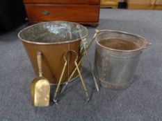 A large copper log bin together with a metal fire bucket and fire tongs etc