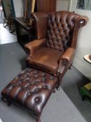 A brown leather Chesterfield style armchair with matching footstool CONDITION REPORT: