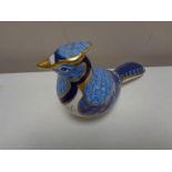 A Royal Crown Derby paperweight modelled as a bird with gold stopper