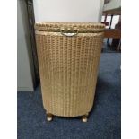 A golden Lloyd loom linen basket