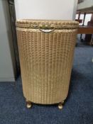 A golden Lloyd loom linen basket