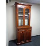 A nineteenth century mahogany bookcase, height 212 cm x width 88 cm, depth 41 cm.