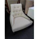 A buttoned fabric studded chair