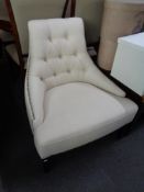 A buttoned fabric studded chair