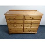 A Ducal pine eight drawer chest