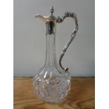 A good quality claret jug with silver plated vine decoration