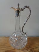 A good quality claret jug with silver plated vine decoration