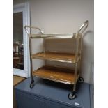 A mid century metal three tier trolley