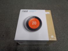 A NEST learning thermostat, new and sealed in box.