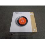 A NEST learning thermostat, new and sealed in box.
