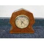 An early 20th century inlaid mahogany eight day mantel clock