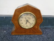 An early 20th century inlaid mahogany eight day mantel clock