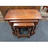 A nest of reproduction oak tables