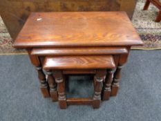 A nest of reproduction oak tables