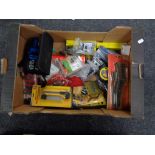 A crate of tape measure, cutting knife,