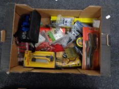 A crate of tape measure, cutting knife,