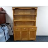 A light oak contemporary kitchen dresser