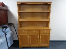 A light oak contemporary kitchen dresser