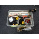 A crate containing tools, saw, clamps, paint spraying pod,